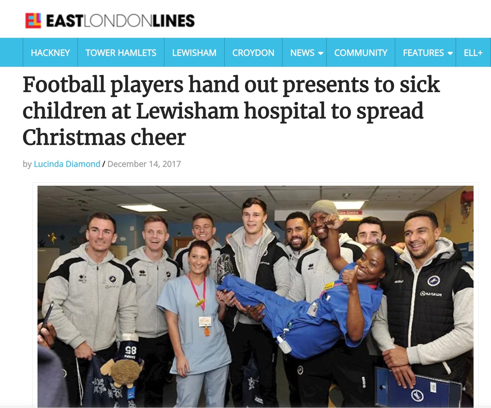 Football players hand out presents to sick children at Lewisham hospital to spread Christmas cheer